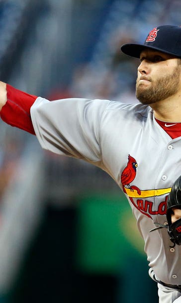 Holliday gets Cards to extra innings, but Escobar, Nats prevail